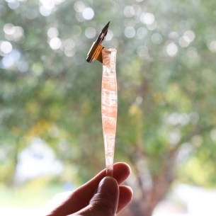 This pen features intricate swirls of pink and white!