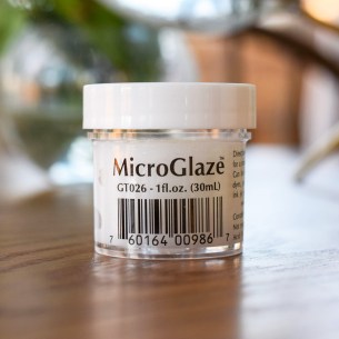 Rub a thin layer of MicroGlaze over your work to protect it from moisture, dirt, and smearing.